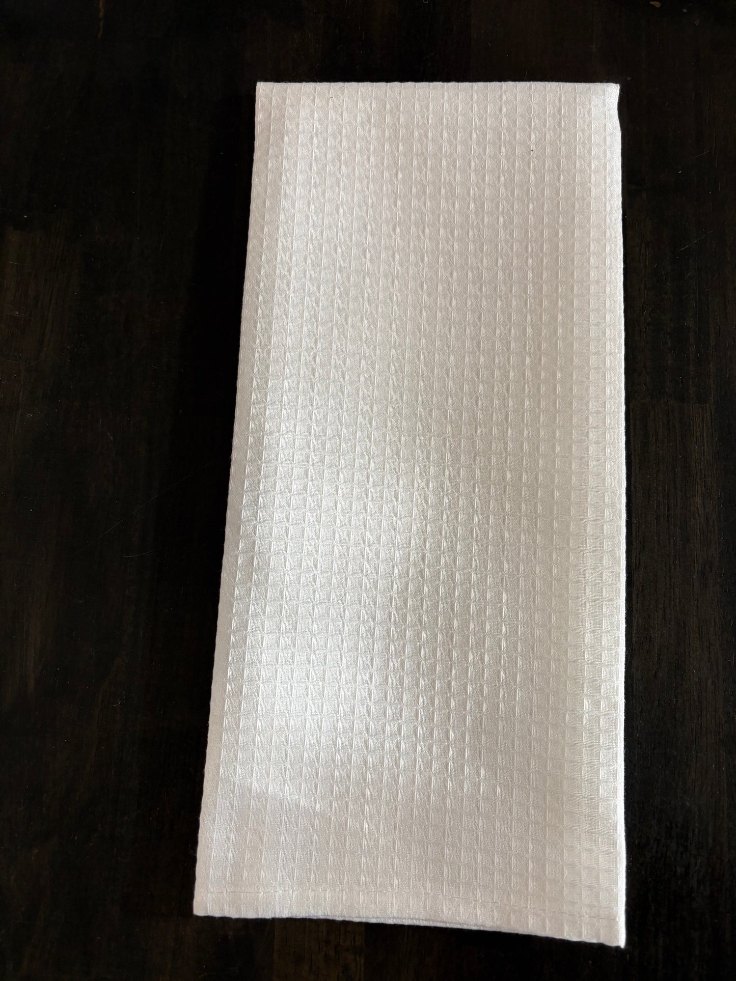 "Custom 100% polyester kitchen towel with full-color sublimation design, flat lay on grey background"