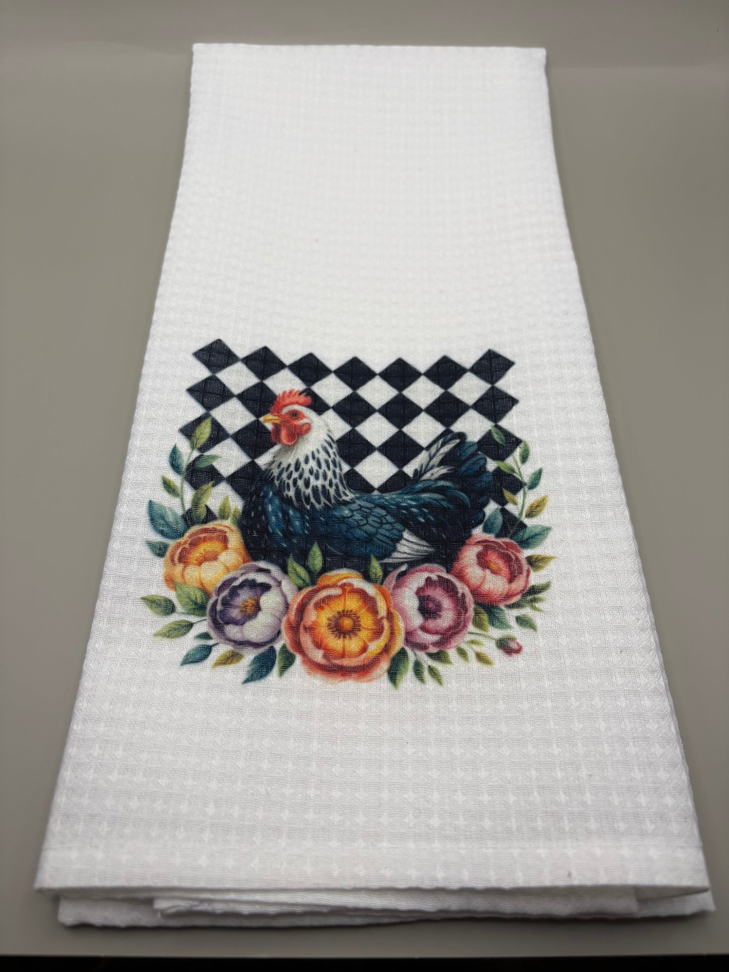 "Custom 100% polyester kitchen towel with full-color sublimation design, flat lay on grey background"
