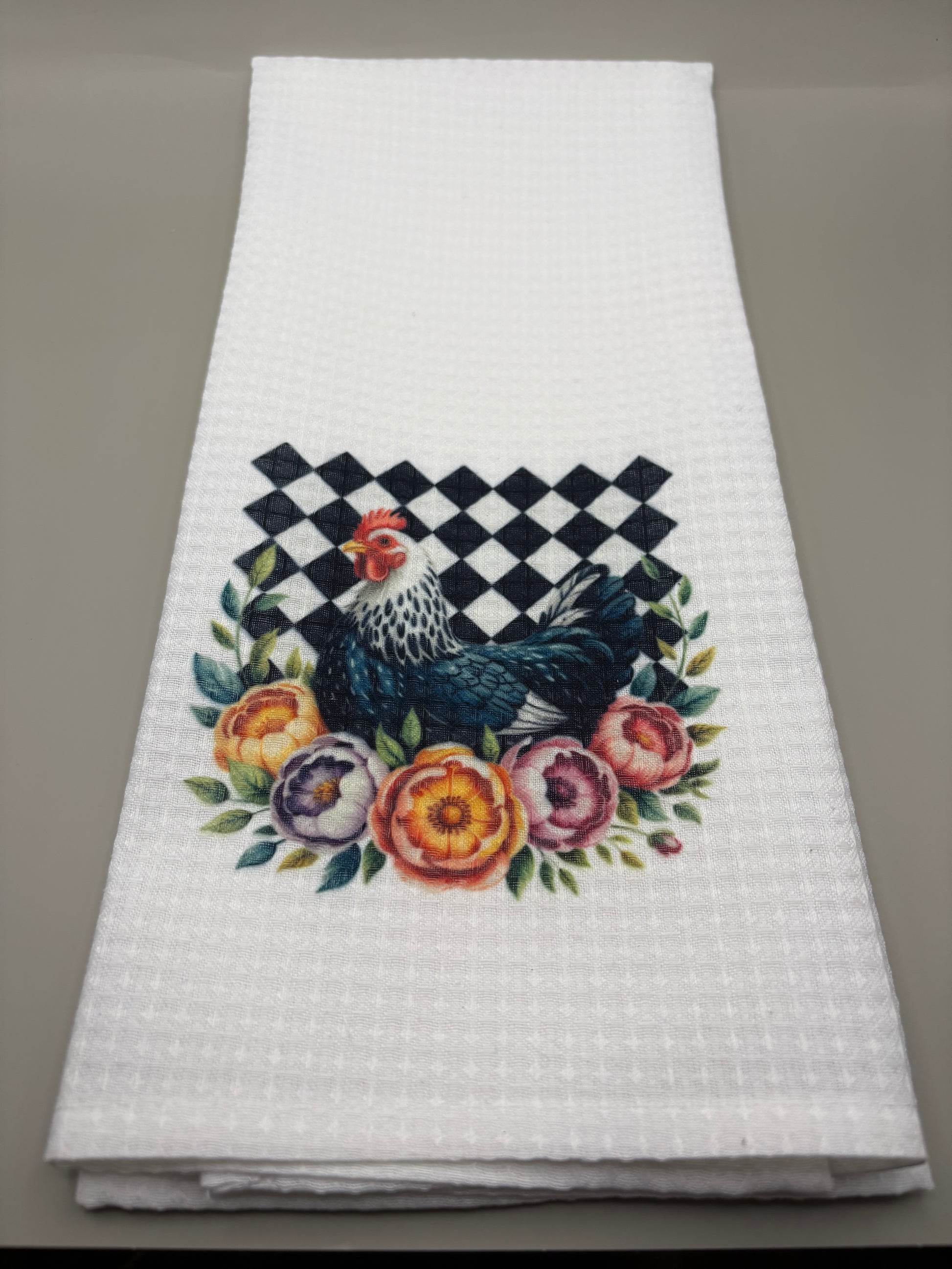 "Custom 100% polyester kitchen towel with full-color sublimation design, flat lay on grey background"